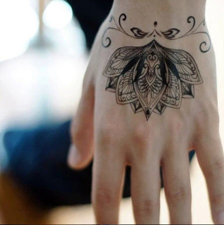Elegant Lotus Flower Tattoo - Image 3