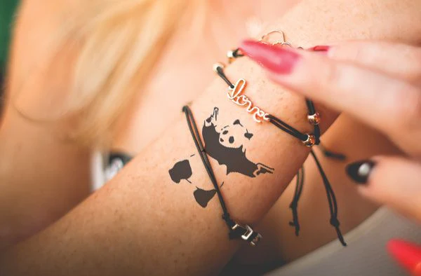 Panda With Guns - Banksy Tattoo - Image 3